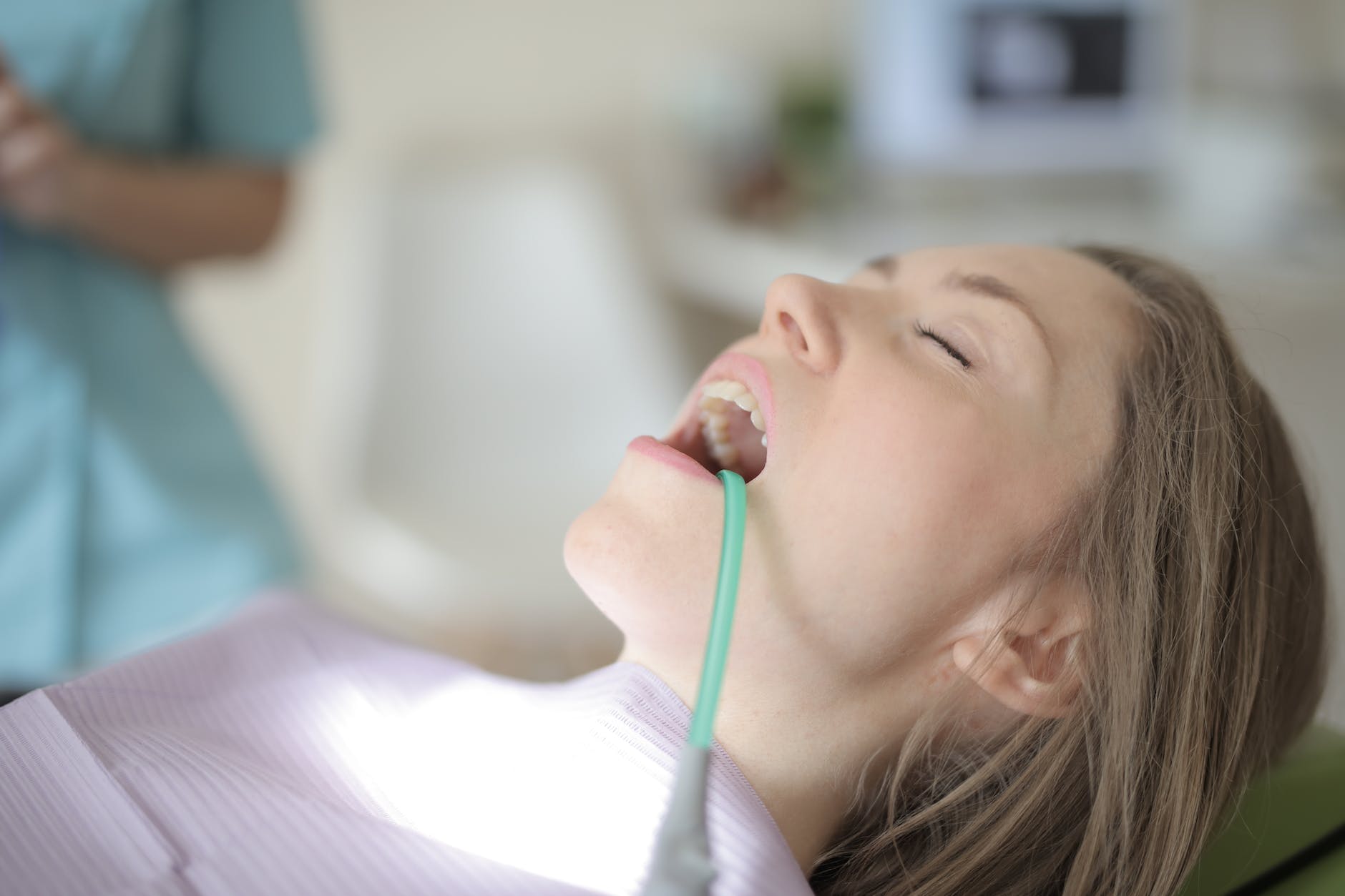 young female patient healing teeth in modern clinic